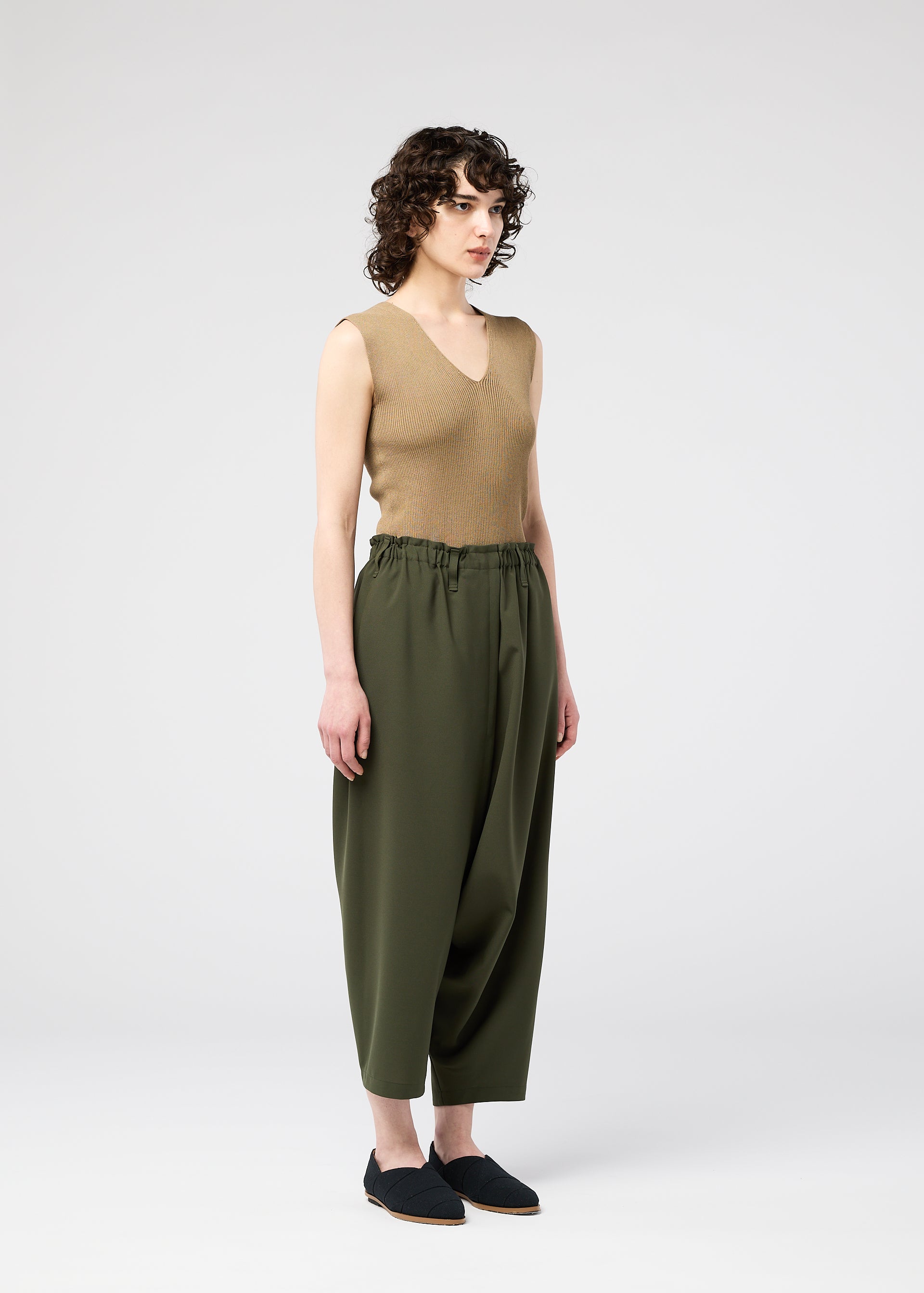 A model wears the 132 5. Issey Miyake SEAMLESS trousers.