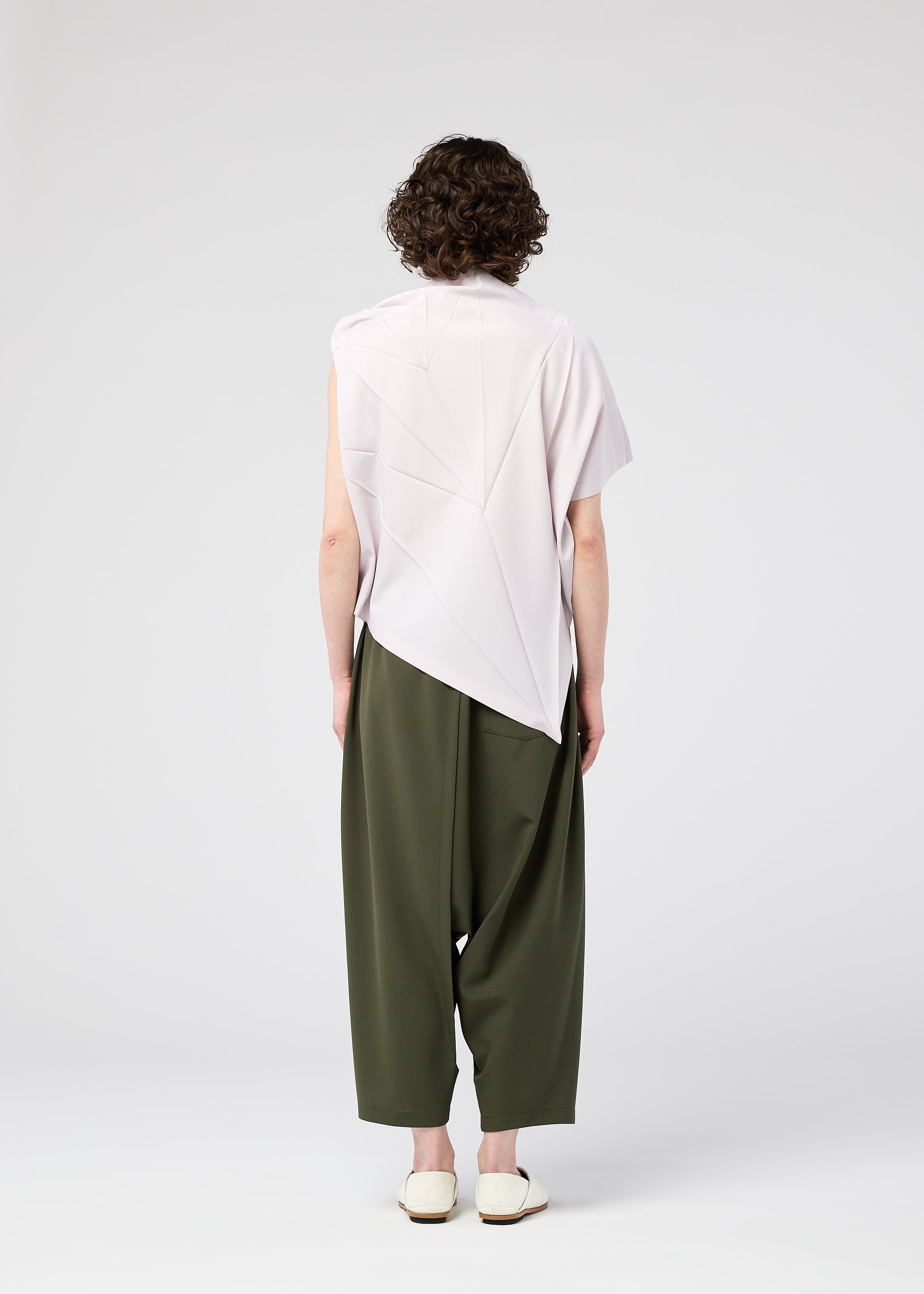 A model wears the 132 5. Issey Miyake RADIAL FOLD Top top.