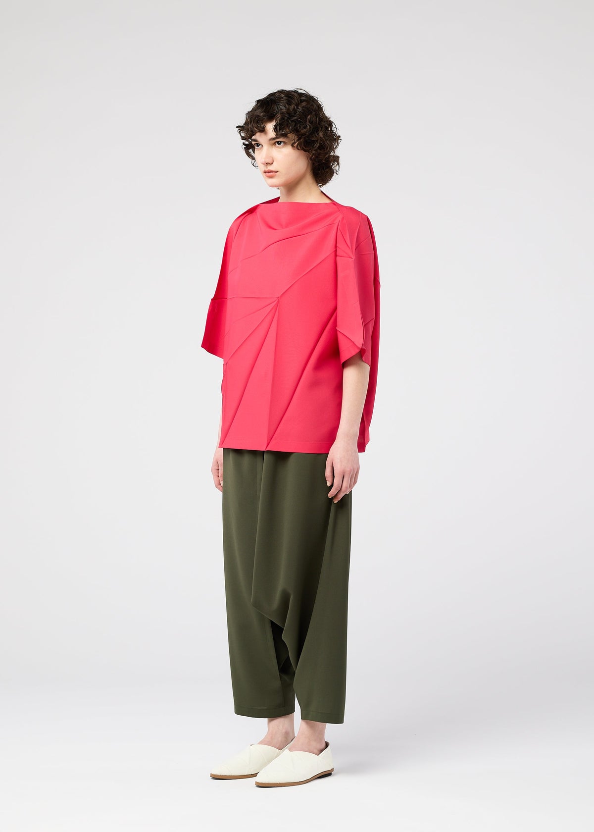 A model wears the 132 5. Issey Miyake RADIAL FOLD Top top.
