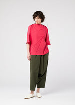 A model wears the 132 5. Issey Miyake RADIAL FOLD Top top.