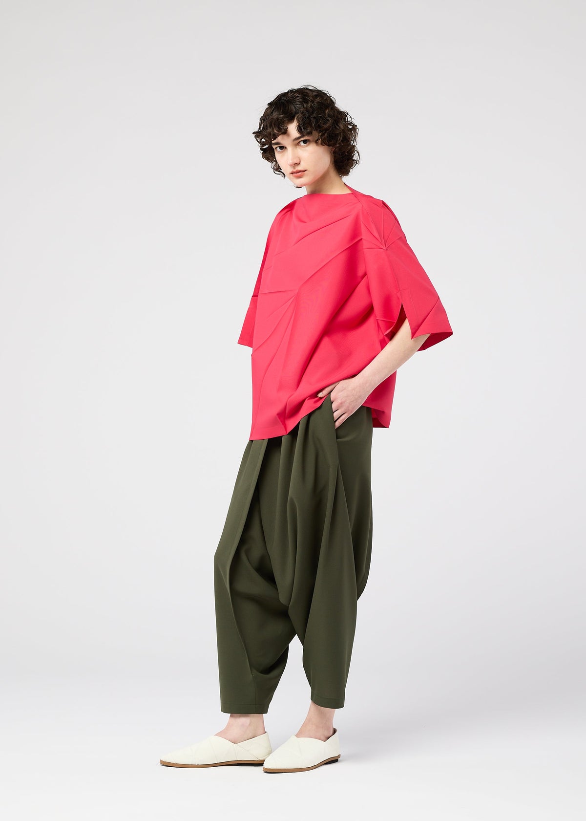 A model wears the 132 5. Issey Miyake RADIAL FOLD Top top.