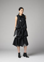 A model wears the 132 5. ISSEY MIYAKE No.1-1 no-10-ramie-dress-black-x-silver.