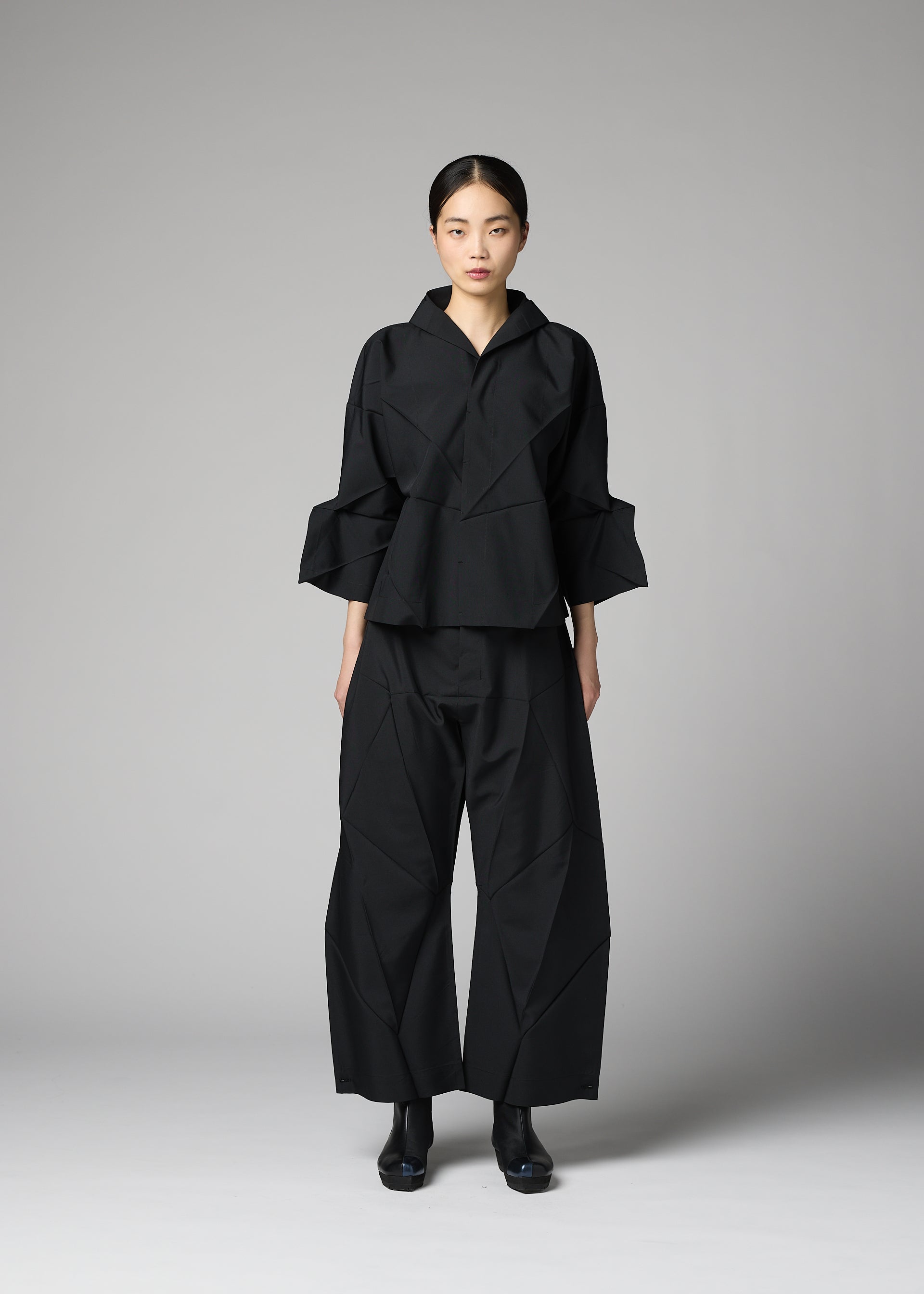 A model wears the 132 5. ISSEY MIYAKE F-SH-1 f-sh-1-shirt-white-2.