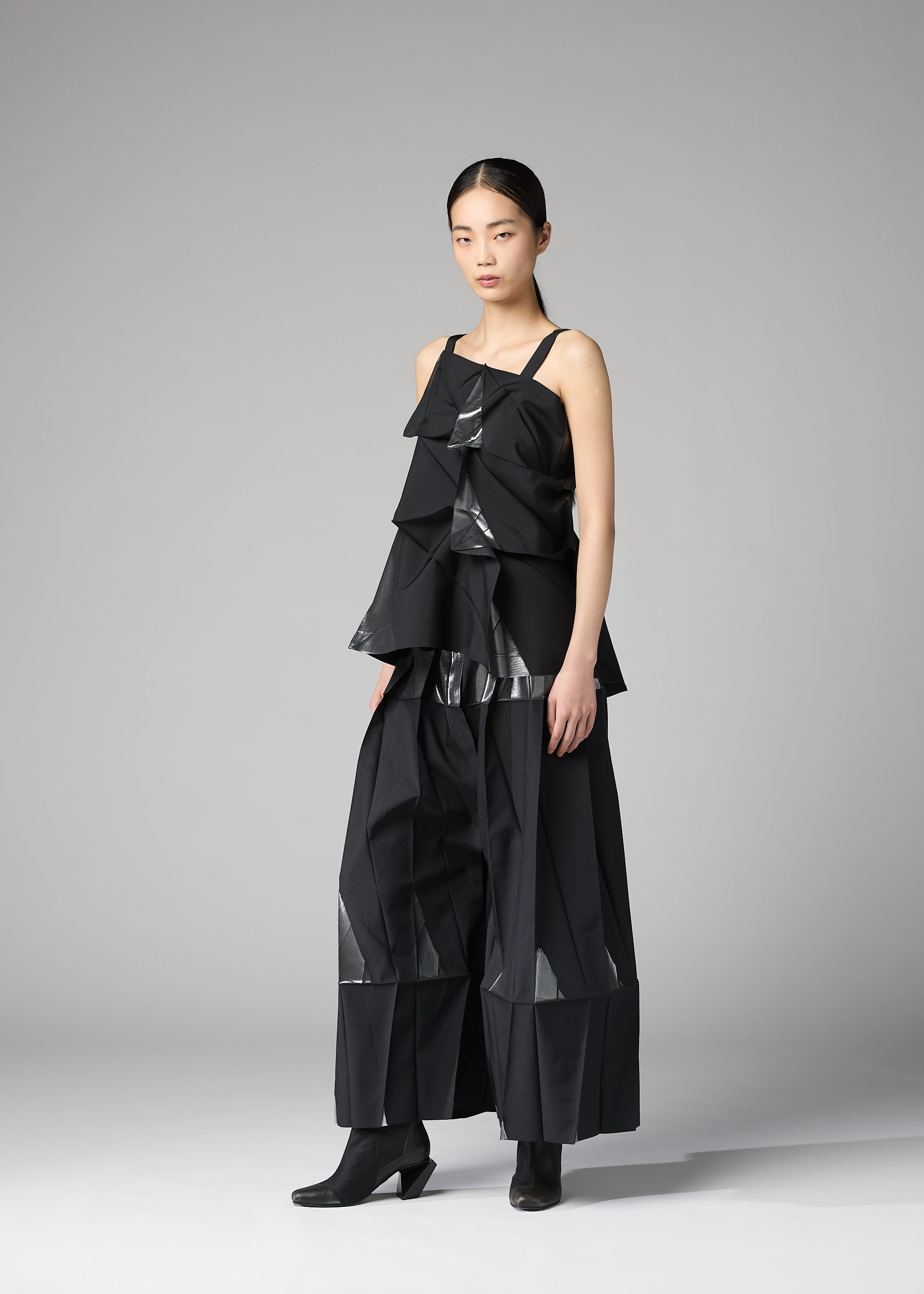 A model wears the 132 5. ISSEY MIYAKE No.1-1 no-10-ramie-shirt-white-x-silver.