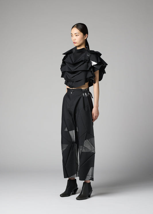 A model wears the 132 5. ISSEY MIYAKE No.10-2 shirt.