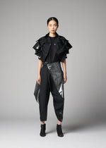 A model wears the 132 5. ISSEY MIYAKE No.10-1 no-10-1-cardigan-black-x-silver-1.