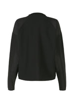 A detail shot of the 132 5. ISSEY MIYAKE F-KN blouse.