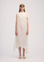 A model wears the ISSEY MIYAKE WRINKLED AND TWISTED dress.