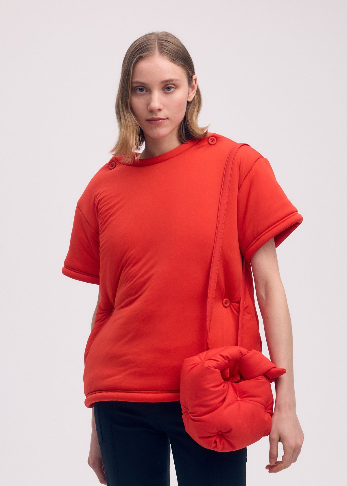 A model wears the Issey Miyake PUMPED BAG bag.