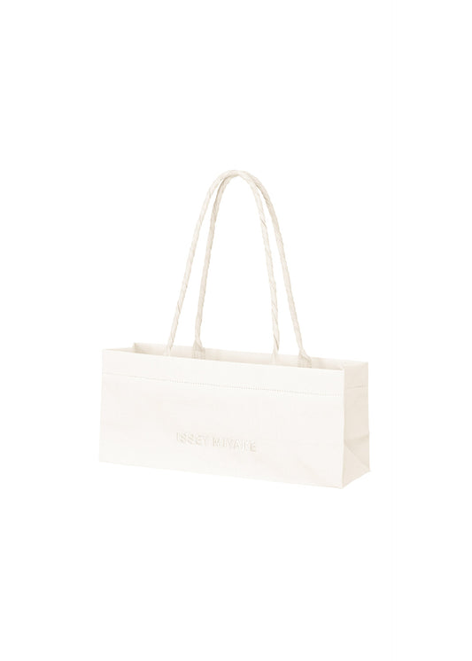 A product shot of the ISSEY MIYAKE THIS IS A PAPER BAG bag in white (01).