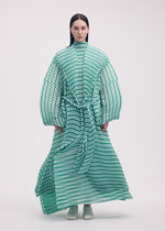 A model wears the Issey Miyake GENERIC STRIPES HAND PLEATS coat.