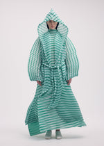 A model wears the Issey Miyake GENERIC STRIPES HAND PLEATS coat.