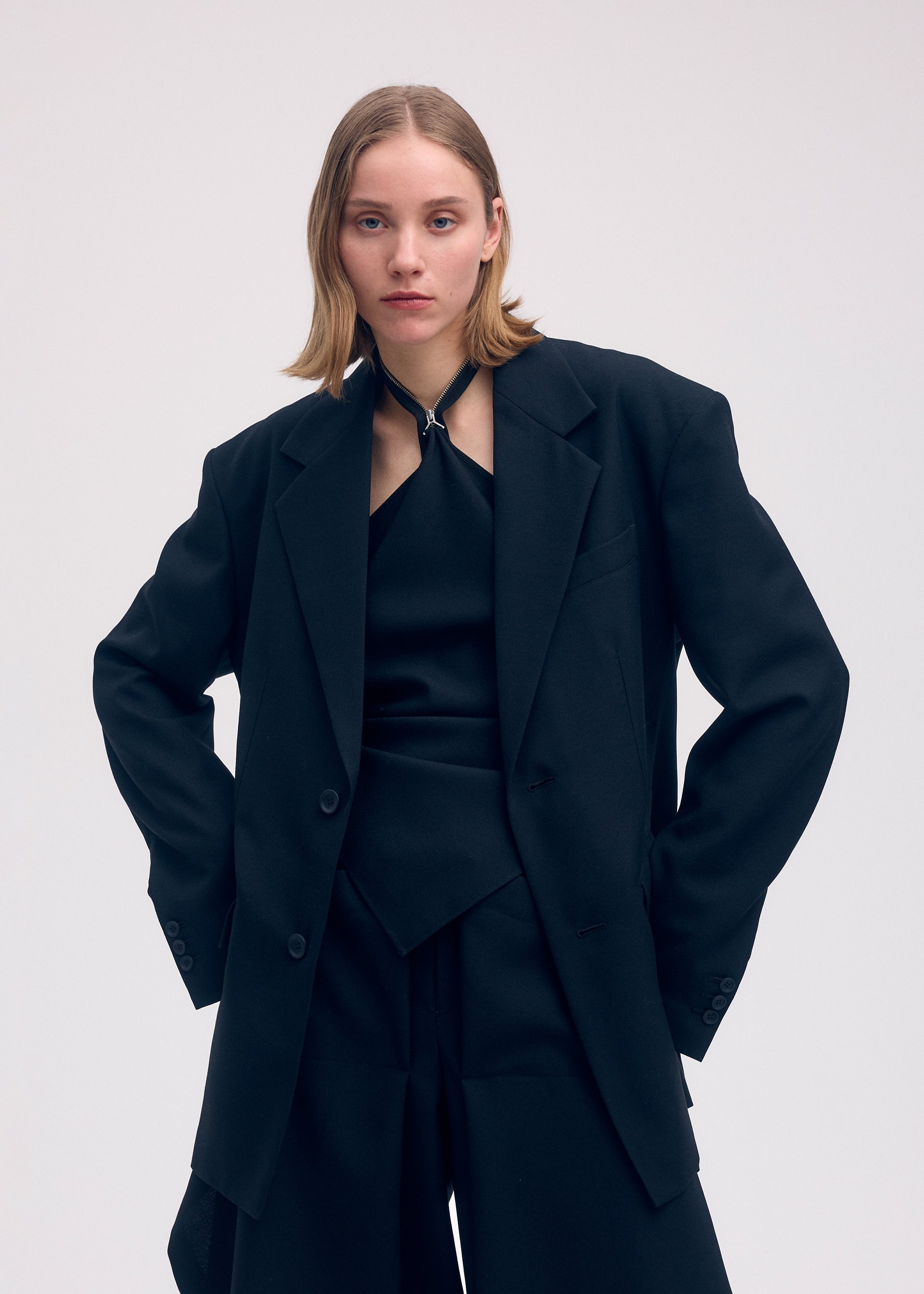 A model wears the Issey Miyake UNI FORM WOOL jacket.