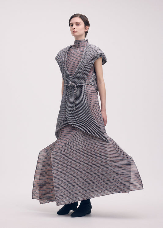 A model wears the Issey Miyake GENERIC STRIPES HAND PLEATS vest.