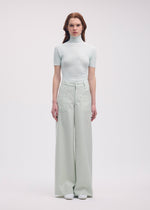 A model wears the Issey Miyake DISPOCKET Pants trousers.