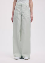 A model wears the Issey Miyake DISPOCKET Pants trousers.