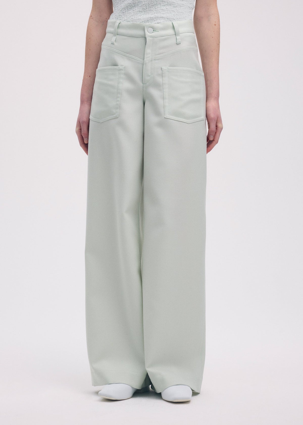 A model wears the Issey Miyake DISPOCKET Pants trousers.