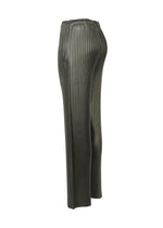 A detail shot of the Issey Miyake GLOSSED METAL PLEATS trousers.