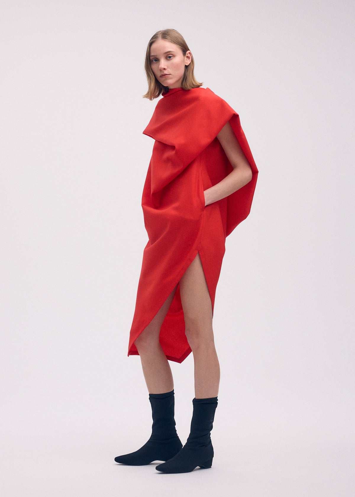 A model wears the Issey Miyake UNI FORM WOOL dress.