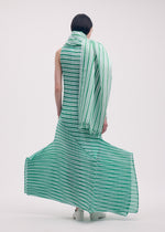A model wears the Issey Miyake GENERIC STRIPES dress.