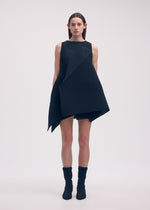 A model wears the ISSEY MIYAKE FOLD PLEATS dress.