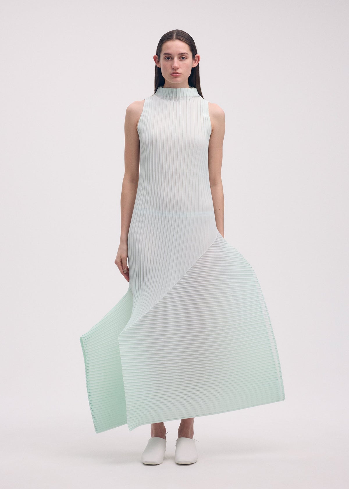 A model wears the ISSEY MIYAKE FOLD PLEATS dress.