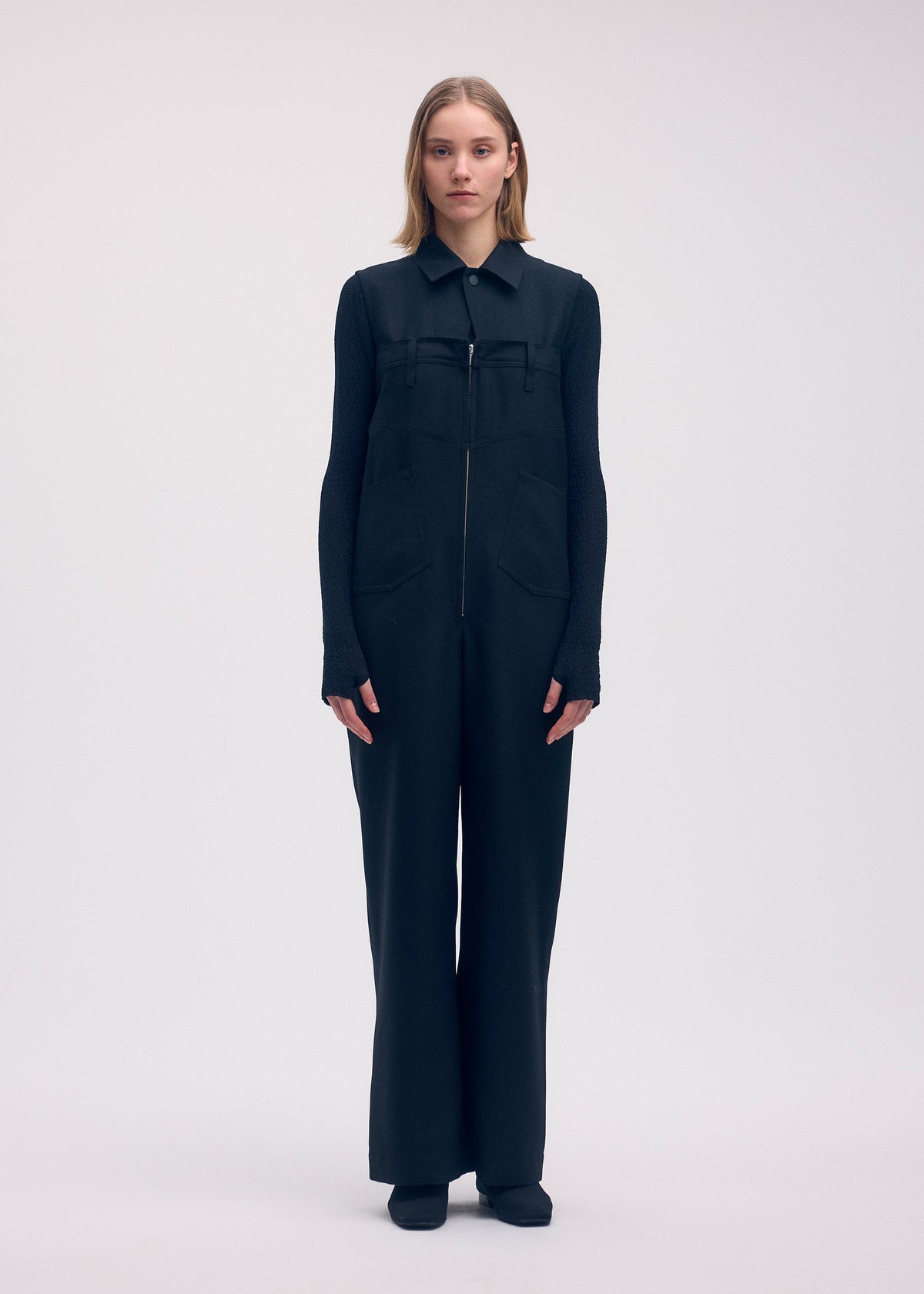 A model wears the Issey Miyake DISPOCKET Pants jumpsuit.