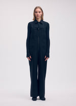 A model wears the Issey Miyake DISPOCKET Pants jumpsuit.