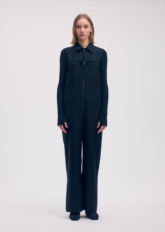 A model wears the Issey Miyake DISPOCKET Pants jumpsuit.