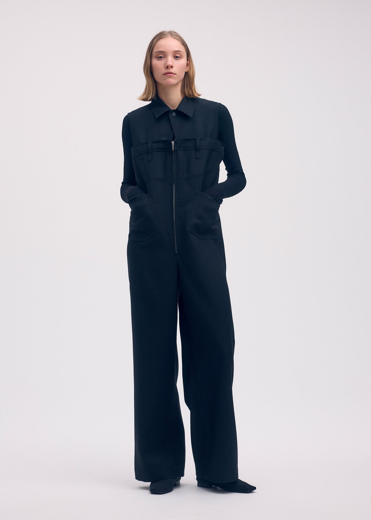 A model wears the Issey Miyake DISPOCKET Pants jumpsuit.