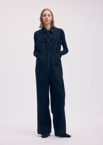 A model wears the Issey Miyake DISPOCKET Pants jumpsuit.