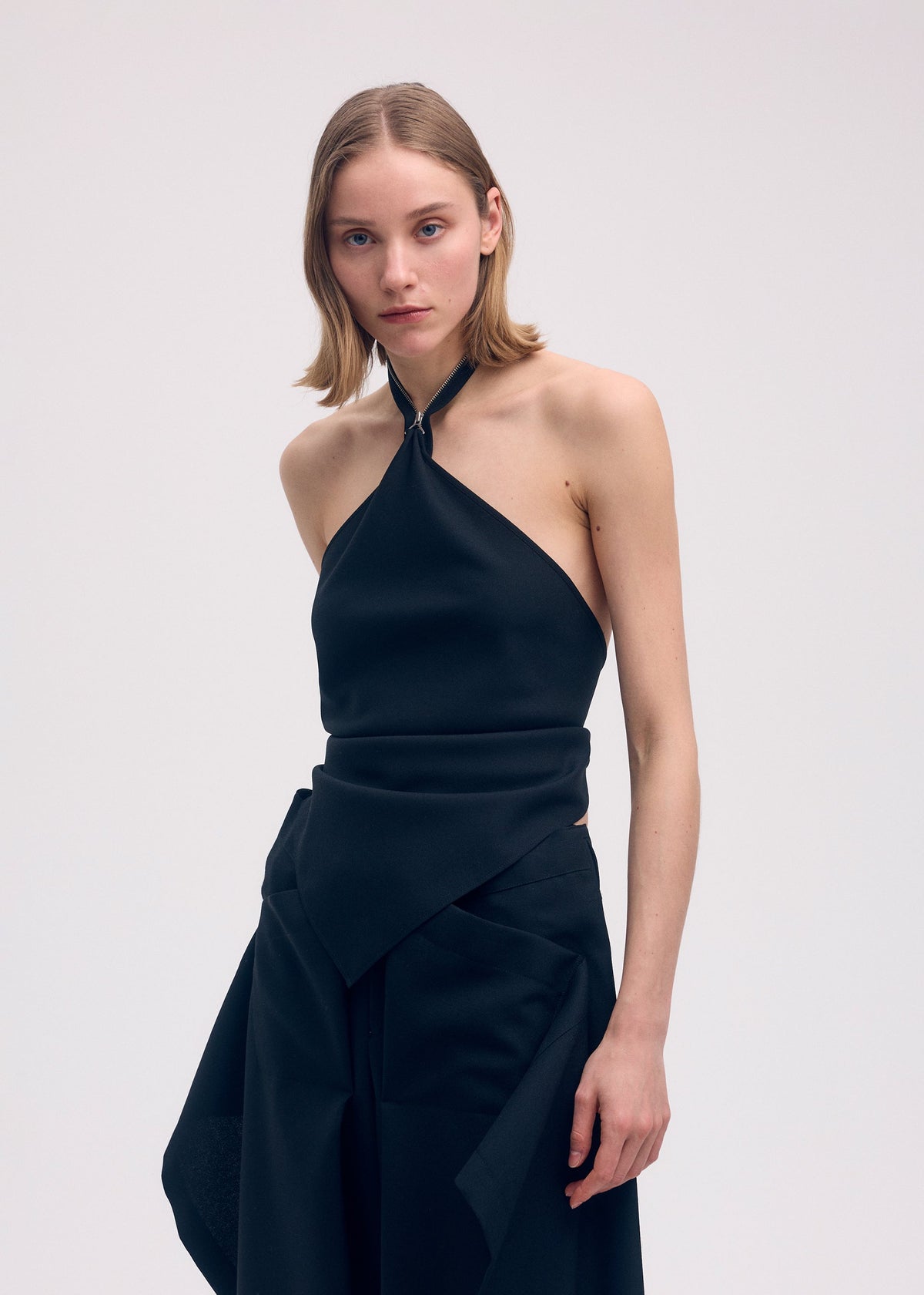 A model wears the Issey Miyake UNI FORM WOOL shirt.