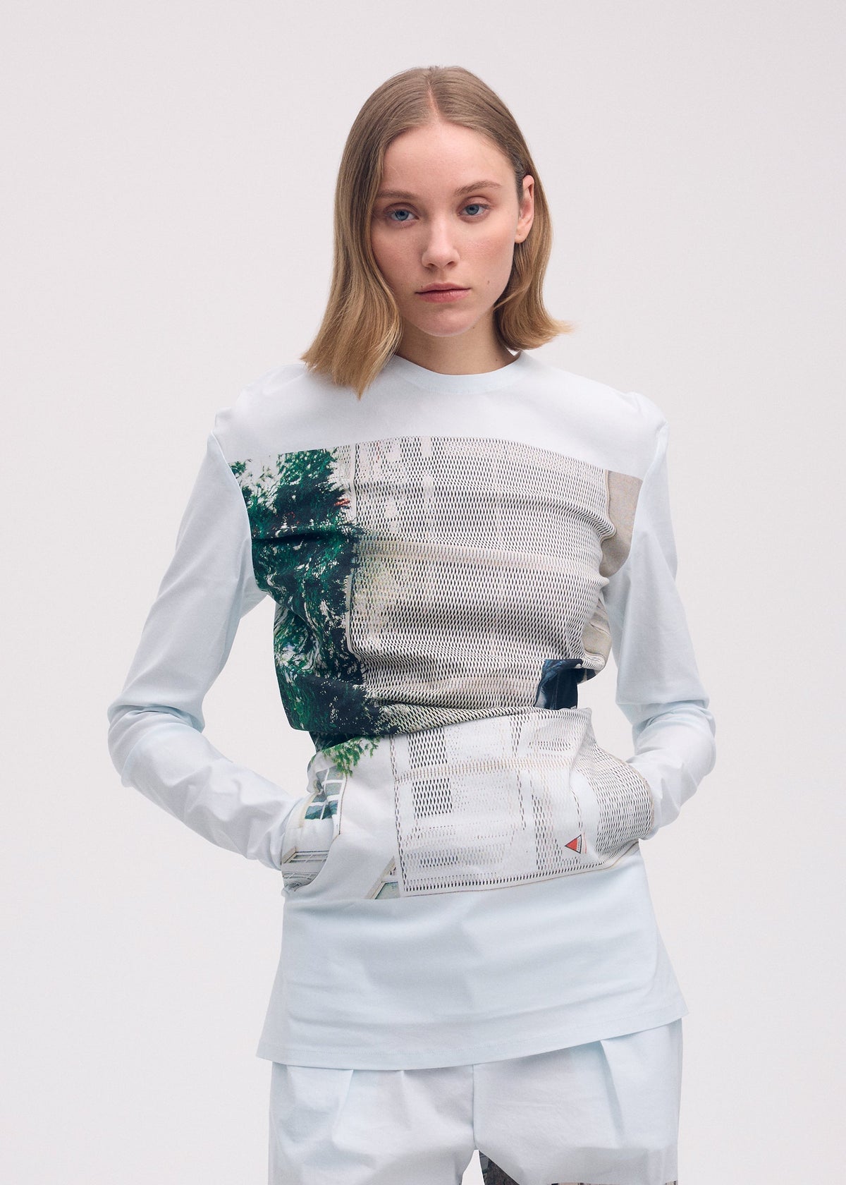 A model wears the Issey Miyake STREET VIEW shirt.
