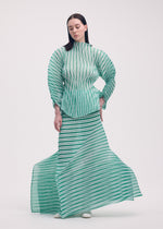 A model wears the Issey Miyake GENERIC STRIPES HAND PLEATS prêt à porter.