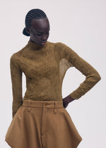 A model wears the Issey Miyake CHIFFON TWIST 3 prêt à porter.