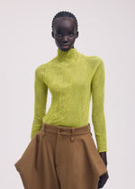 A model wears the Issey Miyake CHIFFON TWIST 3 prêt à porter.