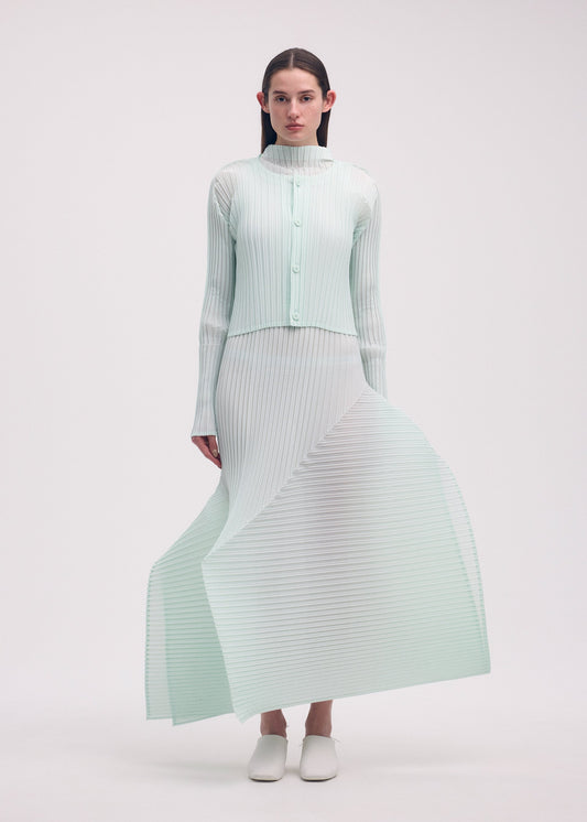 A model wears the ISSEY MIYAKE FOLD PLEATS cardigan.