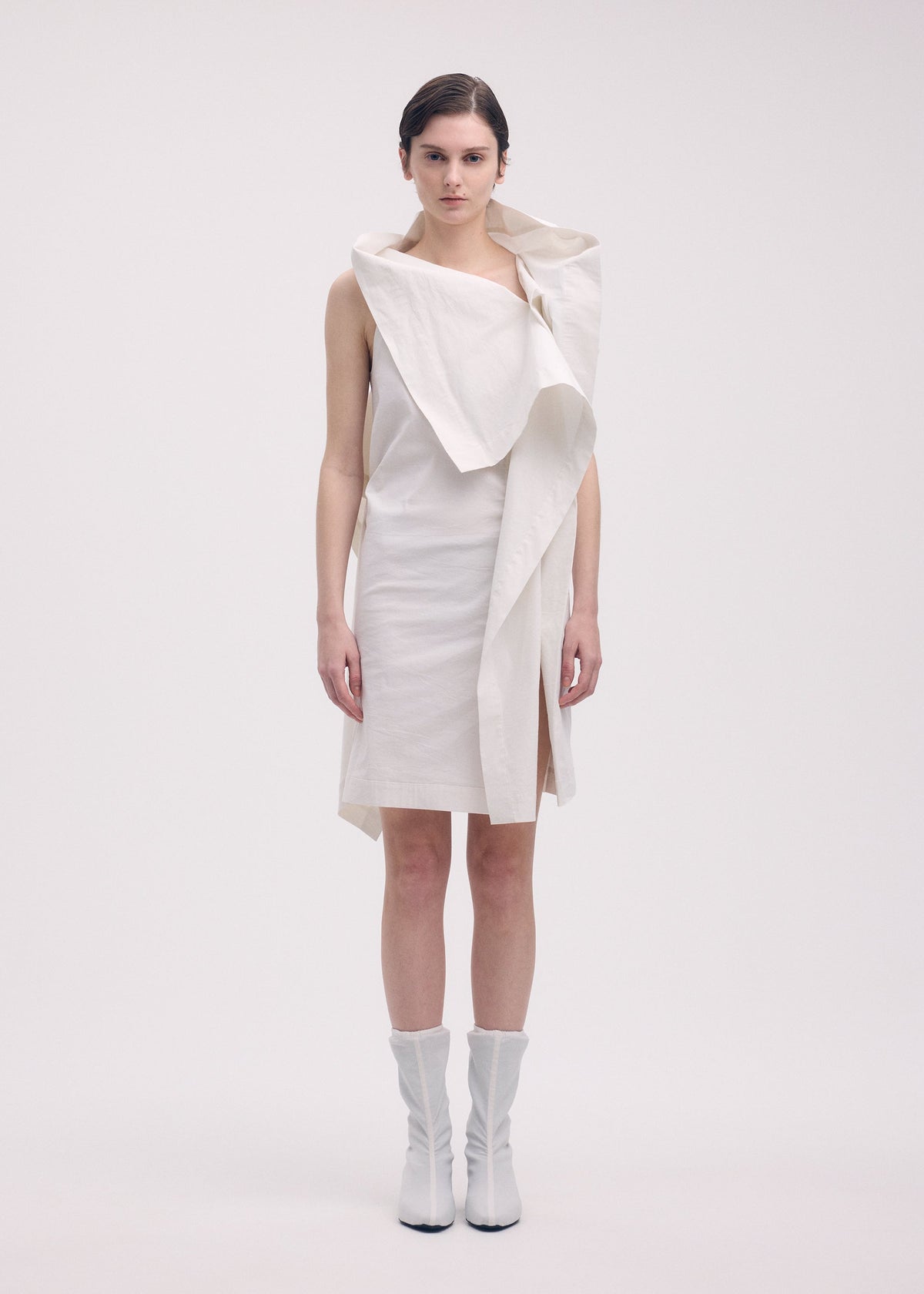 A model wears the Issey Miyake COLLAPSING SCULPTURE dress.