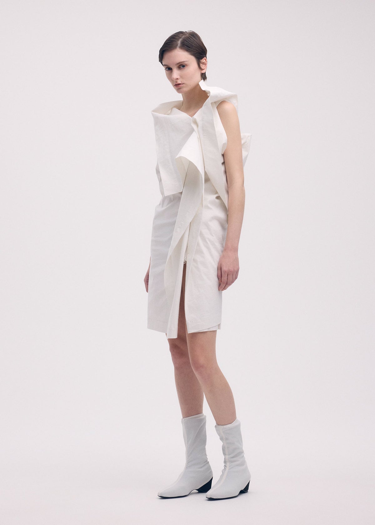A model wears the Issey Miyake COLLAPSING SCULPTURE dress.