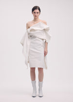 A model wears the Issey Miyake COLLAPSING SCULPTURE dress.