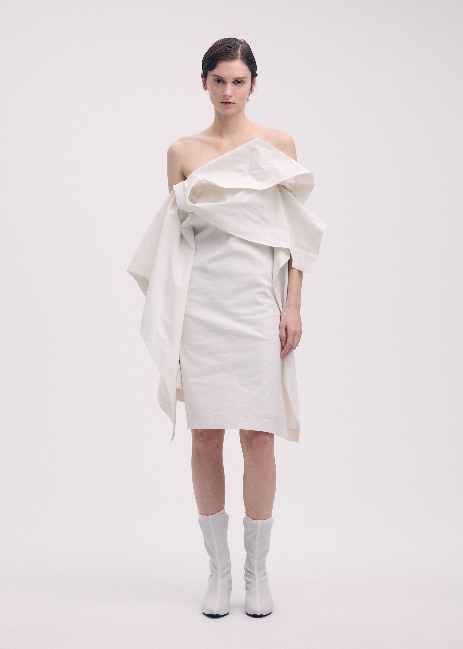A model wears the Issey Miyake COLLAPSING SCULPTURE dress.