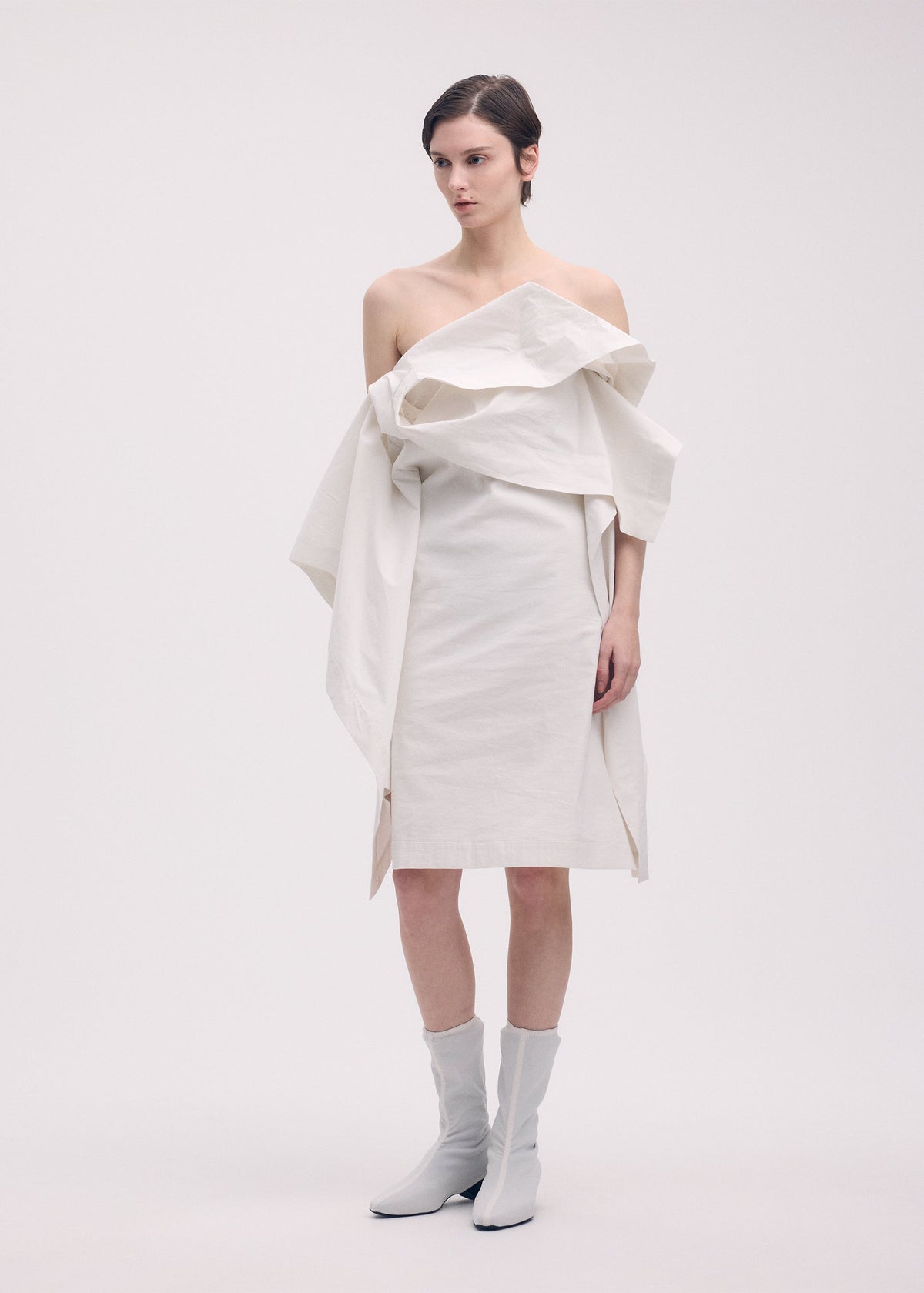 A model wears the Issey Miyake COLLAPSING SCULPTURE dress.