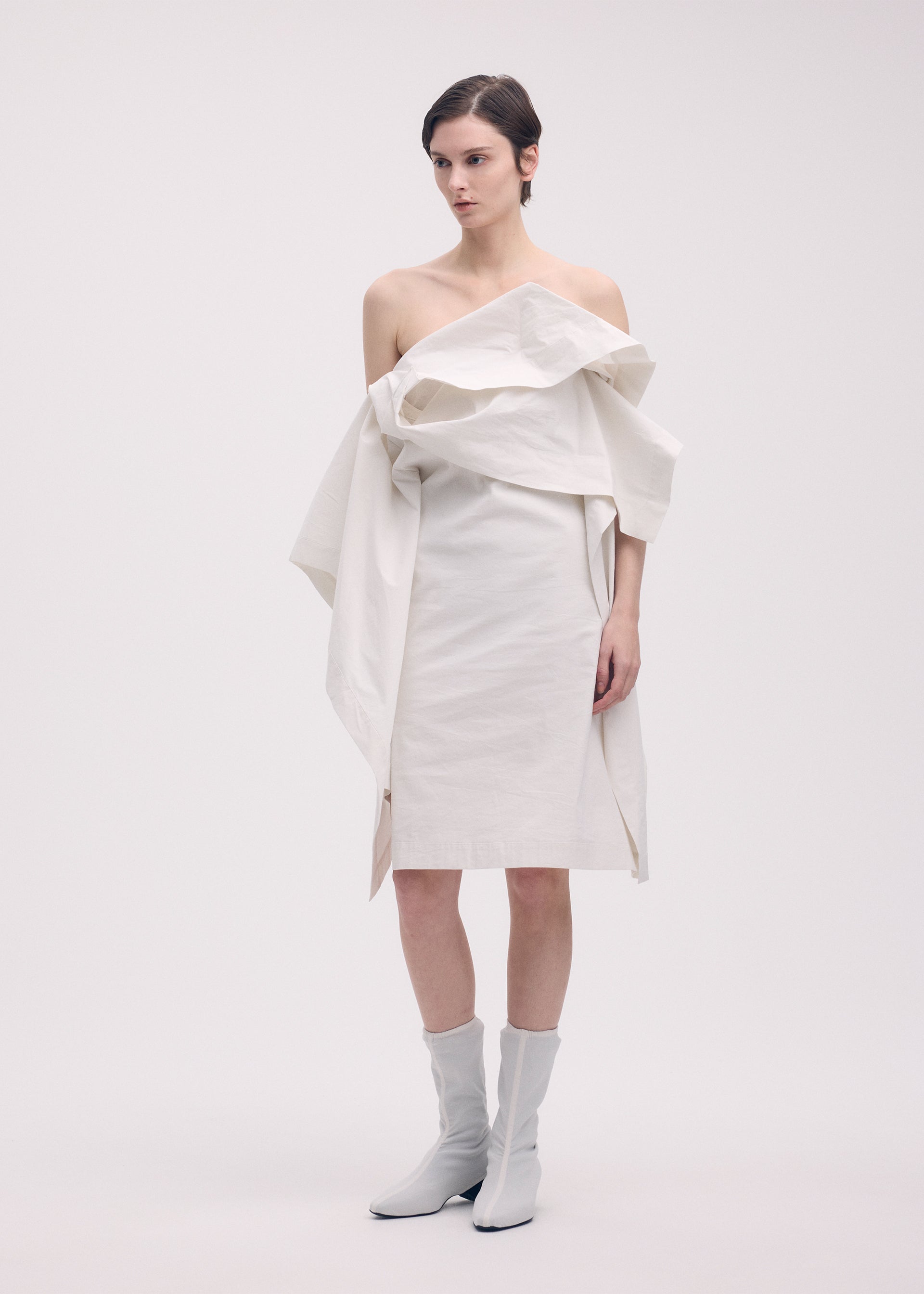 A model wears the Issey Miyake COLLAPSING SCULPTURE dress.