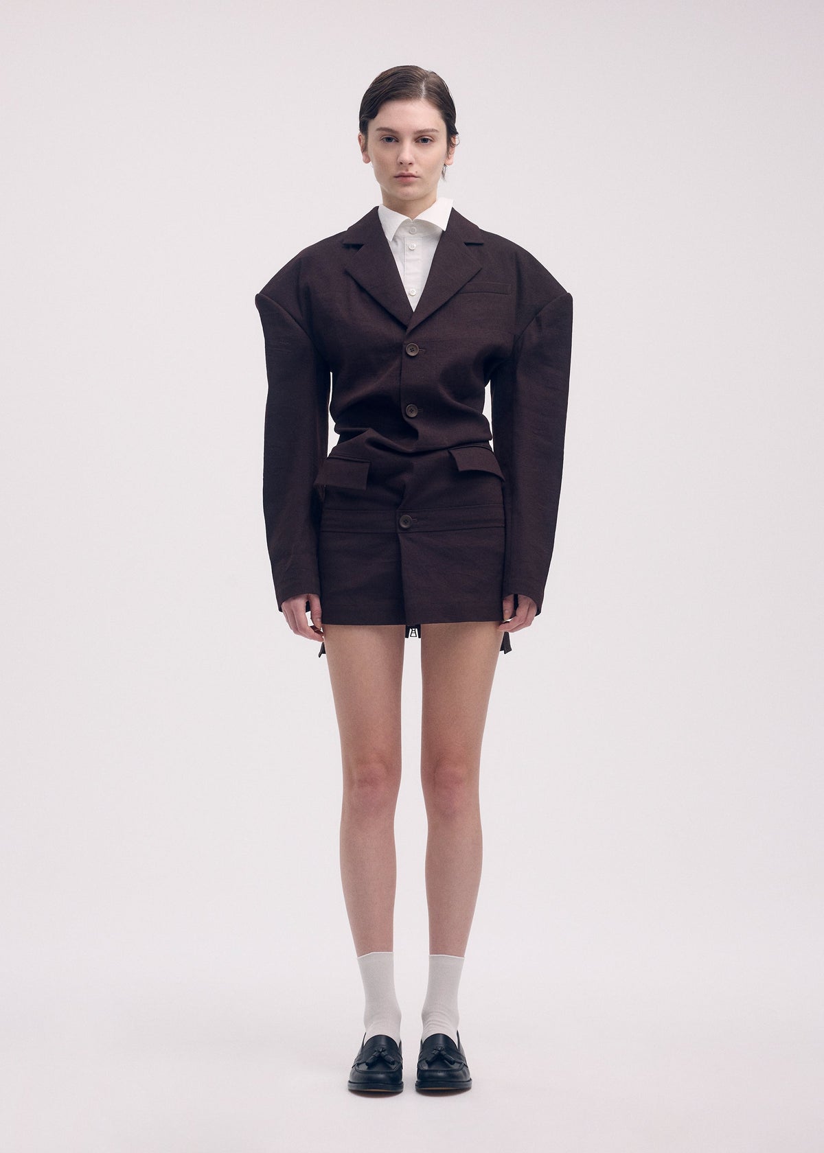 A model wears the Issey Miyake LIKE TORSO LIKE BLAZER dress.