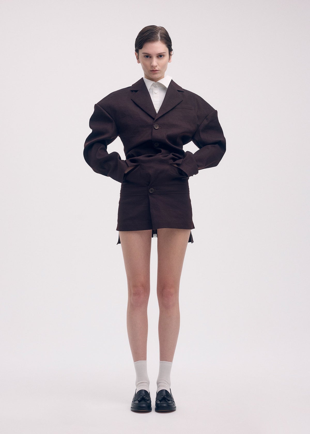 A model wears the Issey Miyake LIKE TORSO LIKE BLAZER dress.