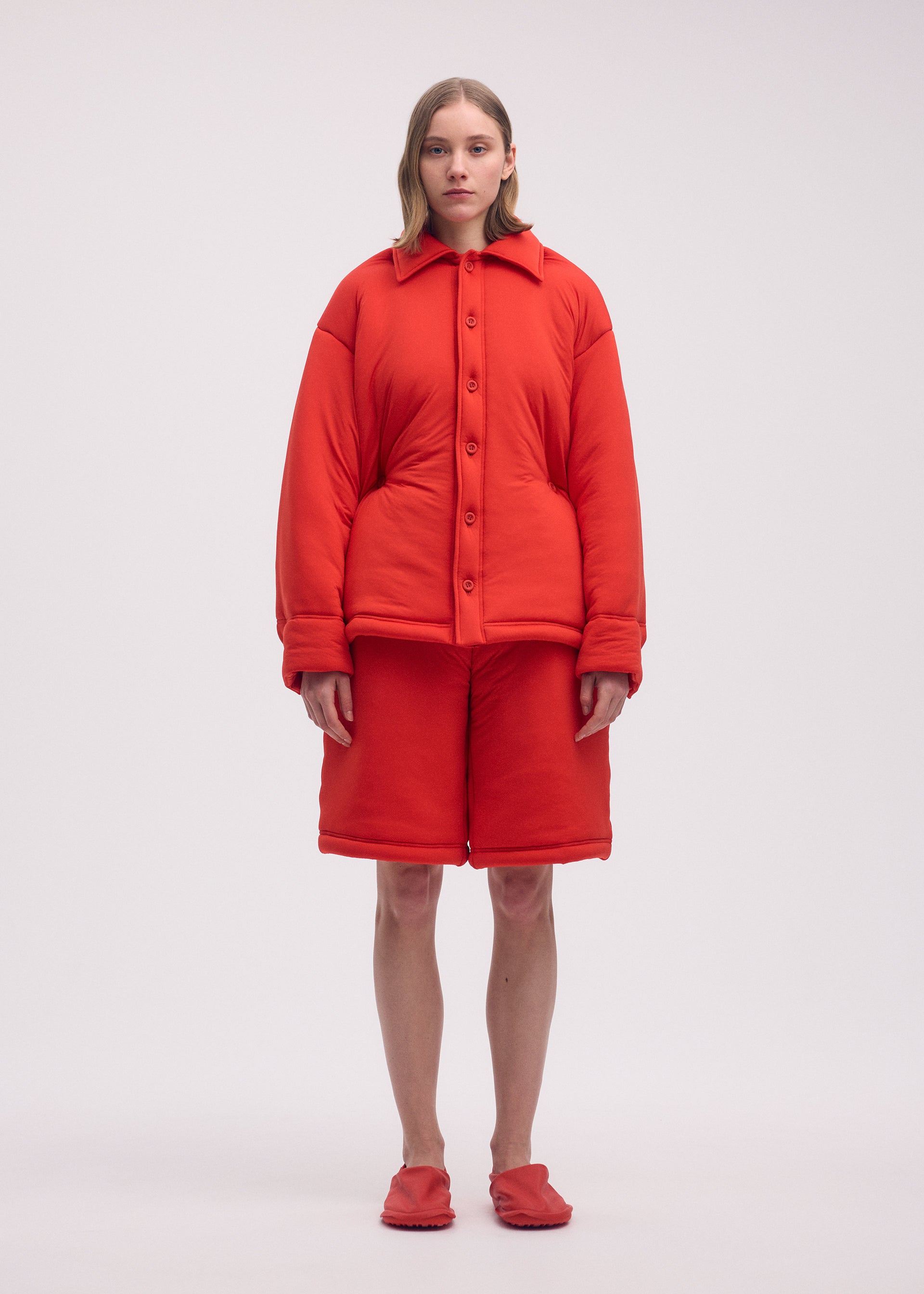 A model wears the ISSEY MIYAKE PUMPED T shirt.