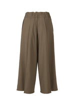 A detail shot of the ISSEY MIYAKE CAMPAGNE trousers.