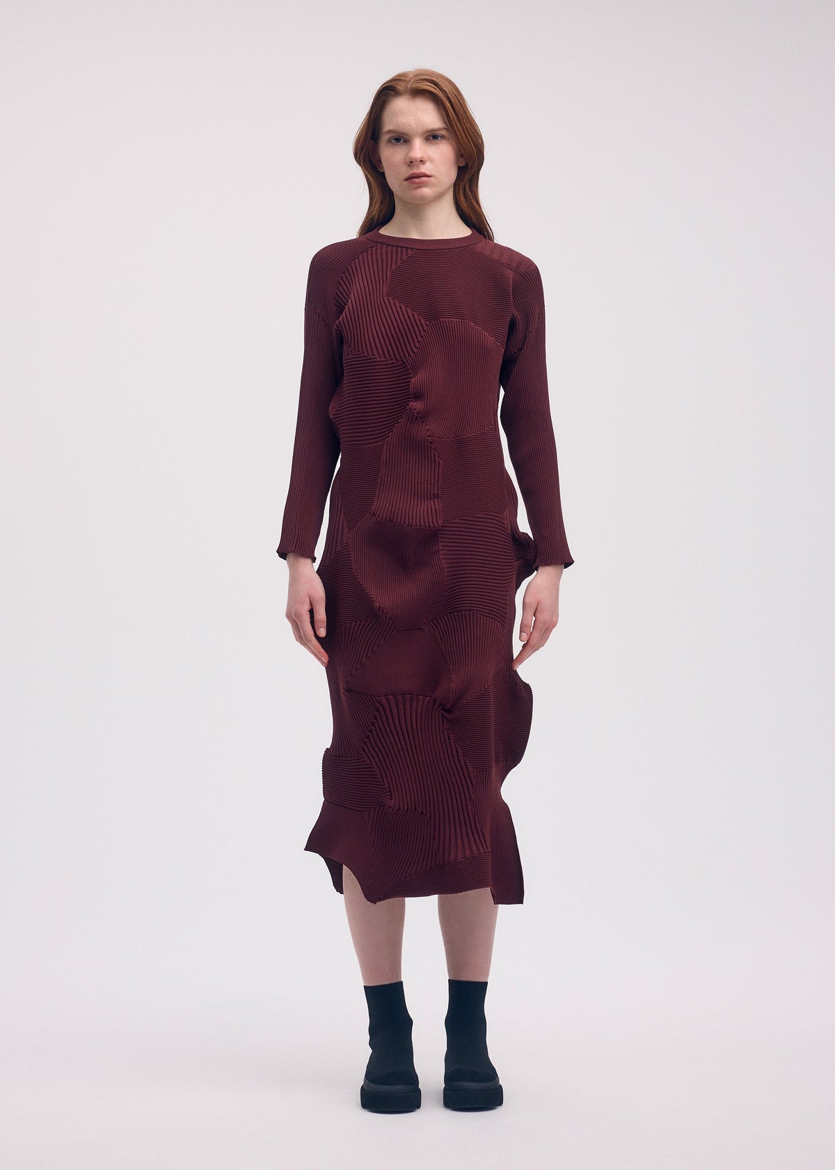 A model wears the Issey Miyake KONE KONE dress.