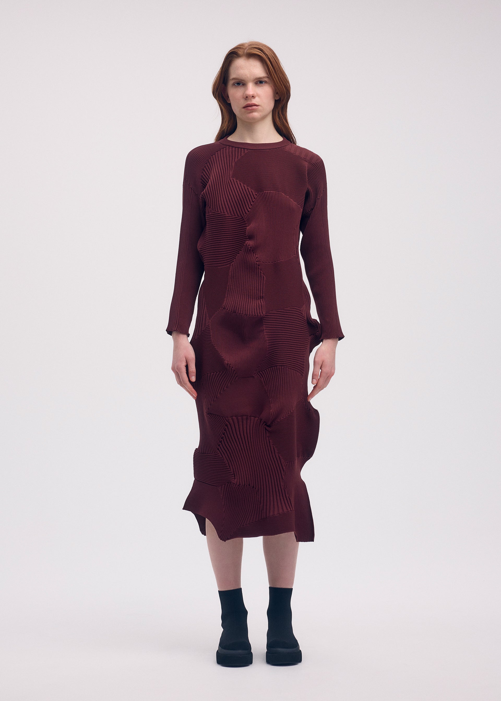 A model wears the Issey Miyake KONE KONE dress.