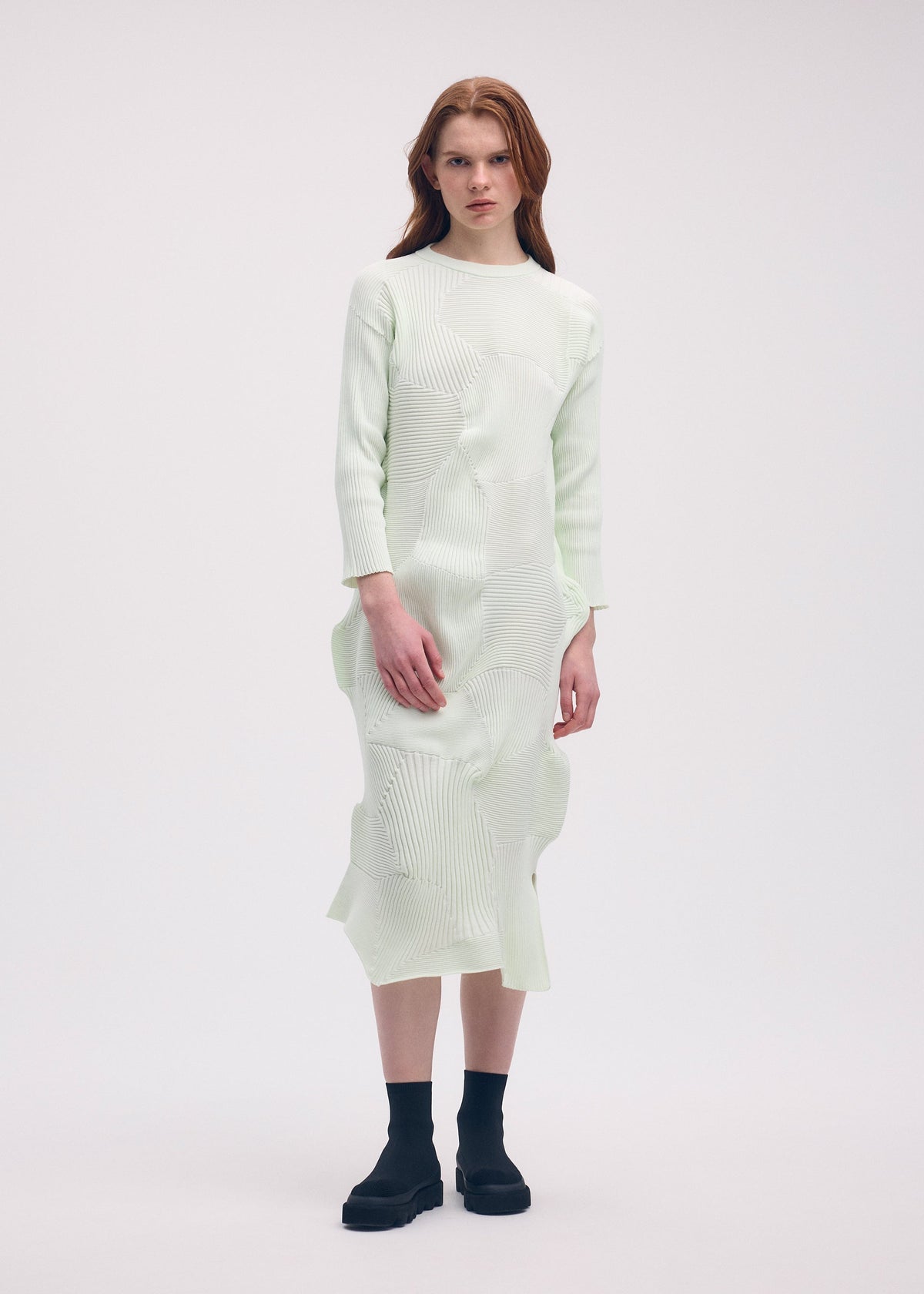 A model wears the Issey Miyake KONE KONE dress.